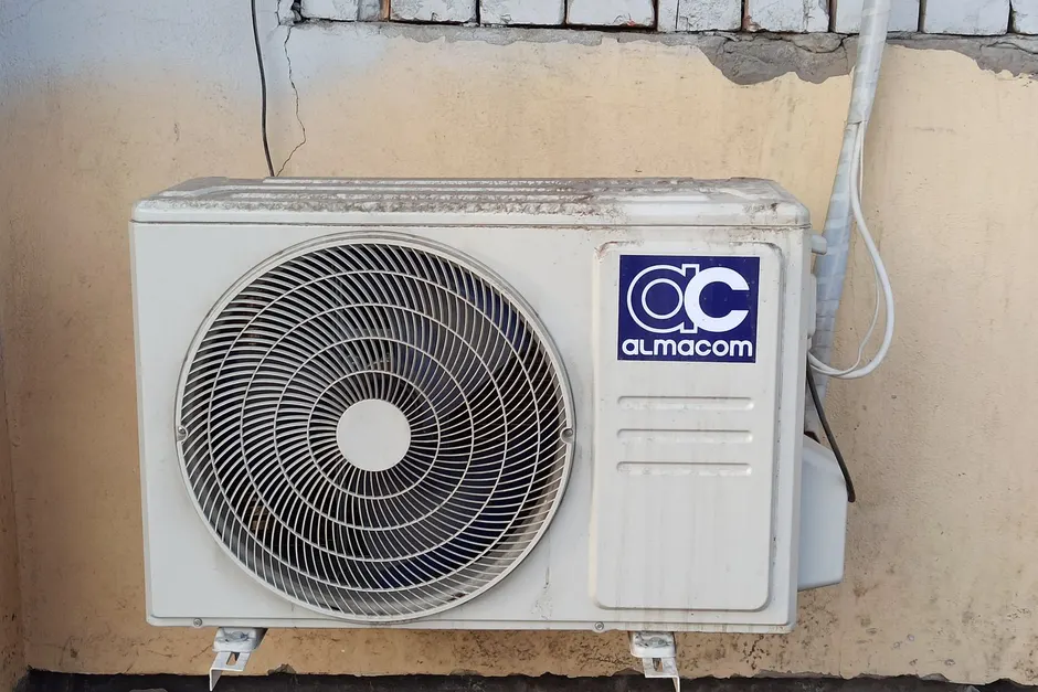 Outdoor air conditioner condenser unit on a home that is running but not cooling